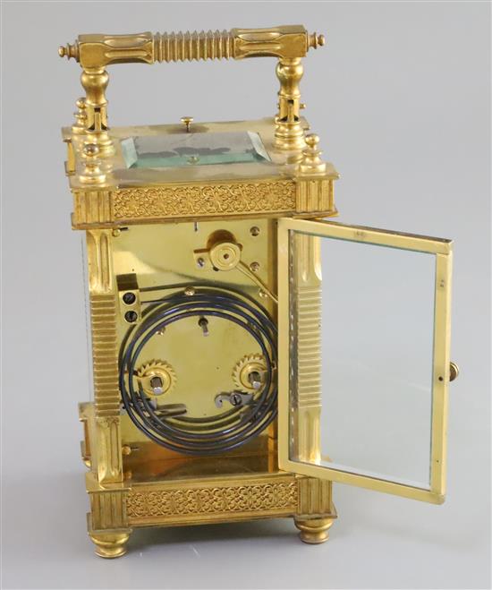 An early 20th century French ormolu hour repeating carriage clock, 6.5in., with red leather travelling case
